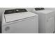 Laundry room with white Whirlpool washer and dryer at 4702 Jasmine Cir, Leesburg, FL 34748