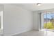 Bright living room with sliding glass doors leading to a patio at 4702 Jasmine Cir, Leesburg, FL 34748