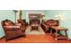 Elegant living room with leather furniture and hardwood floors at 6618 Abeydon Ct, Orlando, FL 32818