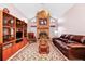 Spacious living room with a fireplace and built-in shelving at 6618 Abeydon Ct, Orlando, FL 32818