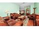 Elegant living room with leather furniture and hardwood floors at 6618 Abeydon Ct, Orlando, FL 32818