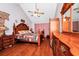 Main bedroom with hardwood floors, large bed, and ceiling fan at 6618 Abeydon Ct, Orlando, FL 32818