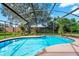 Sparkling blue pool in a screened-in patio area at 6618 Abeydon Ct, Orlando, FL 32818