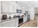 Modern kitchen featuring stainless steel appliances and granite countertops at 7369 Alpine Butterfly Ln, Orlando, FL 32819