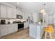 Modern kitchen with island, stainless steel appliances, and granite countertops at 7369 Alpine Butterfly Ln, Orlando, FL 32819