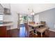 Dining room features a wooden table, bench seating and access to backyard at 7659 Nolton Way, Orlando, FL 32822