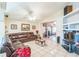 Bright living room with a leather sectional sofa and sliding glass doors leading to a lanai at 7922 Elmstone Cir, Orlando, FL 32822