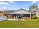 Spacious backyard with patio, screened porch, and above-ground pool at 857 S Atmore Cir, Deltona, FL 32725