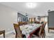 Dining room with wood table and view into the kitchen at 857 S Atmore Cir, Deltona, FL 32725