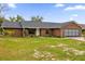 Brick ranch home with attached garage and spacious yard at 857 S Atmore Cir, Deltona, FL 32725