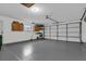 Two-car garage with extra storage and light gray flooring at 857 S Atmore Cir, Deltona, FL 32725