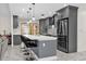 Modern kitchen with gray cabinets, quartz countertops, and stainless steel appliances at 857 S Atmore Cir, Deltona, FL 32725