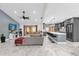 Open concept living room and kitchen with gray cabinets and marble floors at 857 S Atmore Cir, Deltona, FL 32725