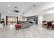 Open living area with gray sectional sofa and modern kitchen at 857 S Atmore Cir, Deltona, FL 32725