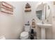 Clean bathroom with pedestal sink and toilet at 859 Bucklebury Loop, Apopka, FL 32703