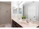 Elegant bathroom with double vanity and a walk-in shower at 875 Assembly Ct, Reunion, FL 34747