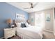 Bright bedroom with a queen-size bed and neutral decor at 875 Assembly Ct, Reunion, FL 34747