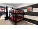 Fun ' bedroom with bunk beds and Mickey Mouse theme at 875 Assembly Ct, Reunion, FL 34747