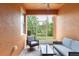 Spacious screened in patio with seating area overlooking the backyard at 875 Assembly Ct, Reunion, FL 34747