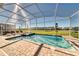 Relaxing screened pool and spa with patio furniture at 8888 Cabot Cliffs Dr, Kissimmee, FL 34747