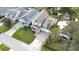 Aerial view showing a two-story house with a large yard and driveway at 1018 Wilks Ave, Belle Isle, FL 32809