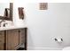 Stylish bathroom with dark wood vanity and updated fixtures at 1018 Wilks Ave, Belle Isle, FL 32809