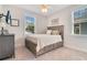 Bright bedroom with a queen-size bed, dresser, and plenty of natural light at 1018 Wilks Ave, Belle Isle, FL 32809