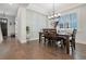 Spacious dining area with hardwood floors and built-in shelving at 1018 Wilks Ave, Belle Isle, FL 32809