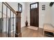 Entryway with hardwood floors, stairs, and a dark wooden door at 1018 Wilks Ave, Orlando, FL 32809