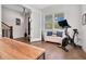 Bright home office with Peloton bike and built-in shelving at 1018 Wilks Ave, Belle Isle, FL 32809