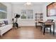 Home office with wood desk and Peloton exercise bike at 1018 Wilks Ave, Belle Isle, FL 32809