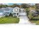 Two-story craftsman home with a two-car garage and a porch at 1018 Wilks Ave, Belle Isle, FL 32809