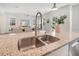 Modern kitchen sink with a sleek, high-arc faucet at 1018 Wilks Ave, Belle Isle, FL 32809