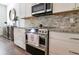 Modern kitchen featuring stainless steel appliances and granite countertops at 1018 Wilks Ave, Belle Isle, FL 32809