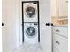 Convenient laundry room with a stacked washer and dryer at 1018 Wilks Ave, Belle Isle, FL 32809