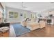 Open living room with hardwood floors and sectional sofa at 1018 Wilks Ave, Belle Isle, FL 32809