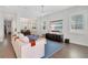 Bright living area with hardwood floors, sectional sofa, and flat-screen TV at 1018 Wilks Ave, Belle Isle, FL 32809