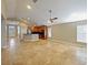 Spacious living area featuring tile flooring and a ceiling fan at 1101 E Pierce Ave, Orlando, FL 32809