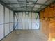 Interior of shed; plywood walls, metal frame, and concrete floor at 1101 E Pierce Ave, Orlando, FL 32809