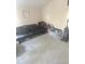 Bonus room with futon couch, suitcases and storage bins at 1241 Melontree Ct # 6, Gotha, FL 34734