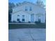 Two-story house with light beige exterior, two-car garage, and landscaping at 1241 Melontree Ct # 6, Gotha, FL 34734
