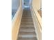 Staircase with carpeted steps and neutral wall colors at 1241 Melontree Ct # 6, Gotha, FL 34734