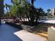 Steps leading to a community pool area with tropical landscaping and lounge chairs at 306 Scottsdale Sq # 306, Orlando, FL 32801