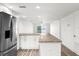Modern kitchen with island, stainless steel appliances and granite countertops at 3807 S Atlantic Ave # 2020, Daytona Beach, FL 32118