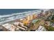 Aerial view of beachfront condo building, highlighting its location and surrounding amenities at 3807 S Atlantic Ave # 2020, Daytona Beach, FL 32118