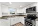 Modern kitchen with stainless steel appliances and granite countertops at 3807 S Atlantic Ave # 2020, Daytona Beach, FL 32118