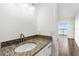 Ocean view from bathroom with granite countertop and updated sink at 3807 S Atlantic Ave # 2020, Daytona Beach, FL 32118