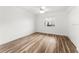 Bright bedroom with ceiling fan, hardwood floors and double door closet at 3807 S Atlantic Ave # 2020, Daytona Beach, FL 32118