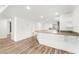 Bright kitchen featuring a large island and hardwood floors at 3807 S Atlantic Ave # 2020, Daytona Beach, FL 32118