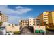 Condo building parking area with ocean view, showing building exterior and landscaping at 3807 S Atlantic Ave # 2020, Daytona Beach, FL 32118